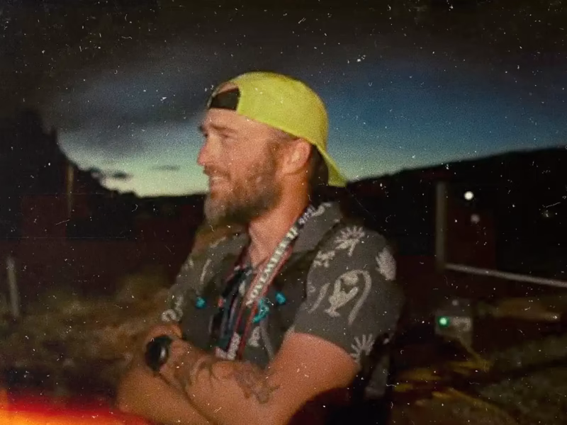 Man at the finish line of an ultratrail race in the desert of Utah.
