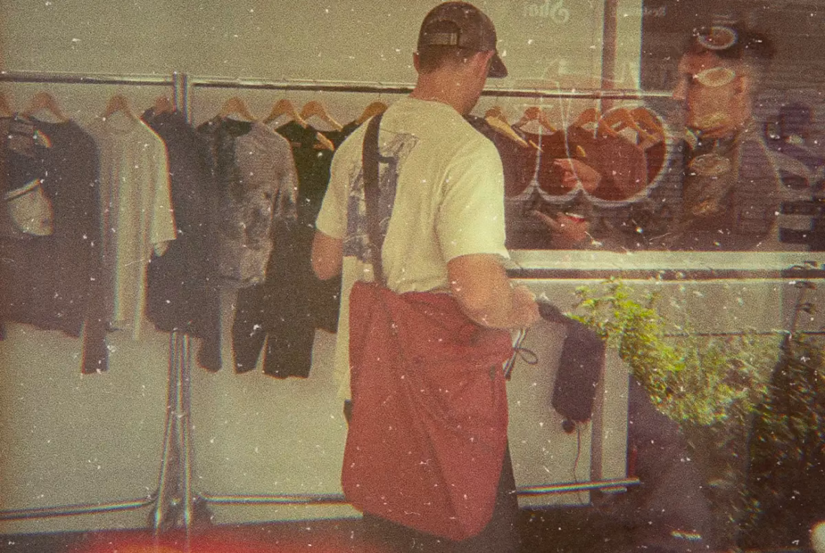 A man standing in front of Portal's Paris Fashion Week release