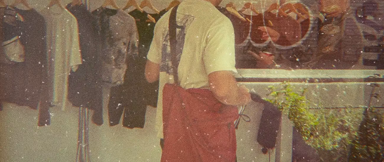 A man standing in front of Portal's Paris Fashion Week release