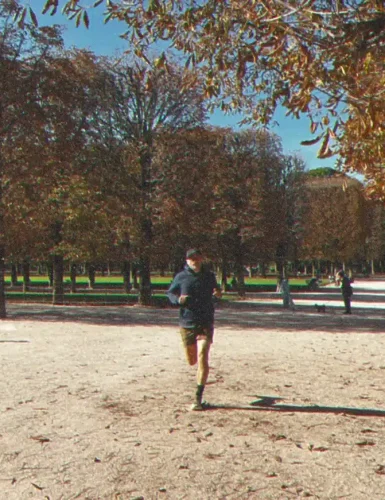 Runner in a park with trees