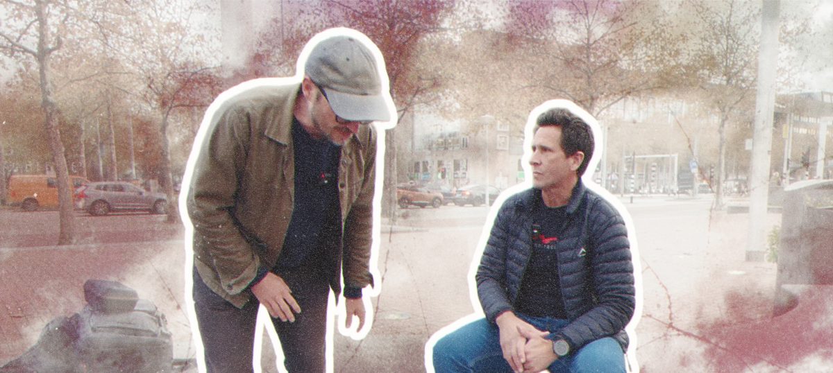 Two friends in a city setting.