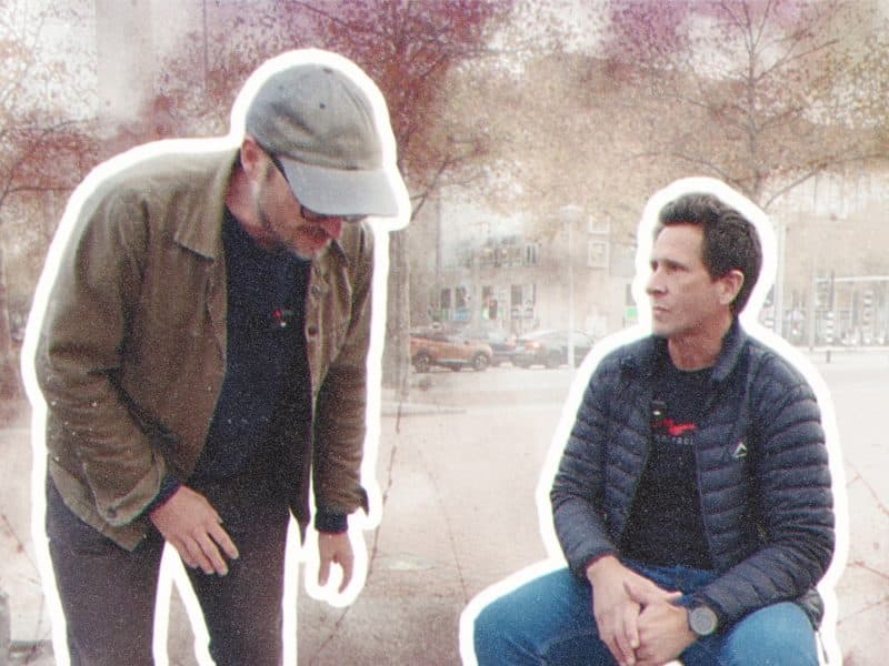 Two friends in a city setting.