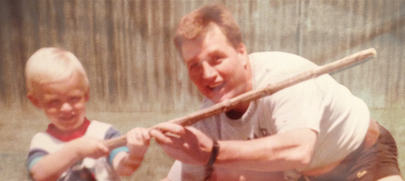 Runner celebrating at finish line.