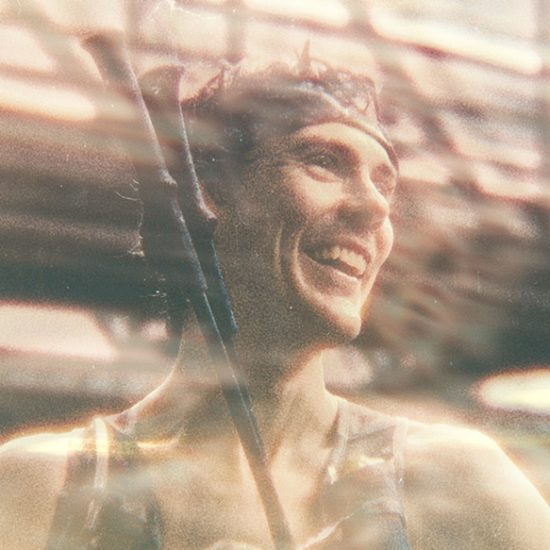 Person in a blurred urban setting. Scott Jurek.