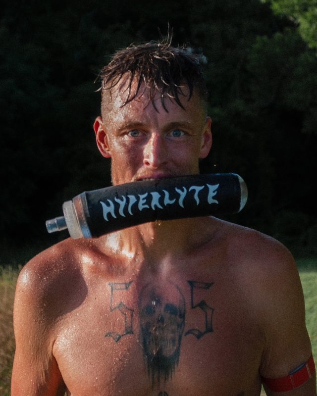 Person holding trekking poles outdoors