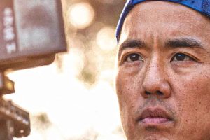 Man focused on filming outdoors. Billy Yang