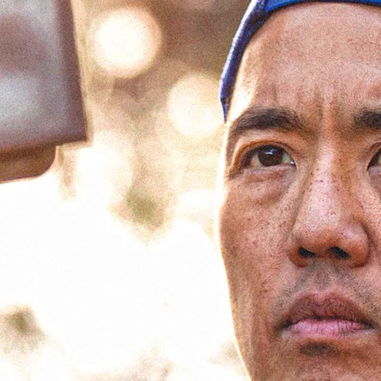 Man focused on filming outdoors. Billy Yang