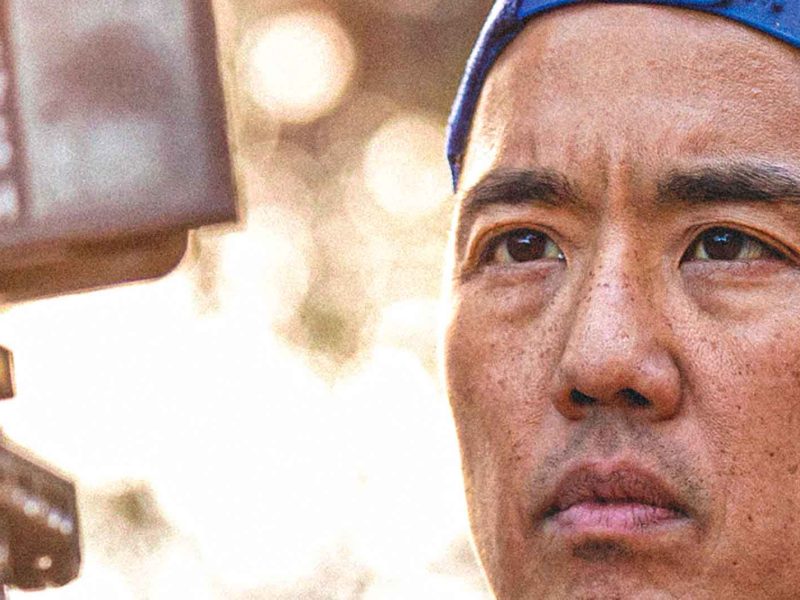 Man focused on filming outdoors. Billy Yang