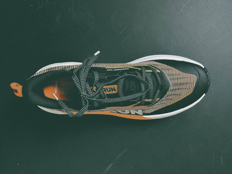 Black and orange athletic sneaker top view Kipsummit Max
