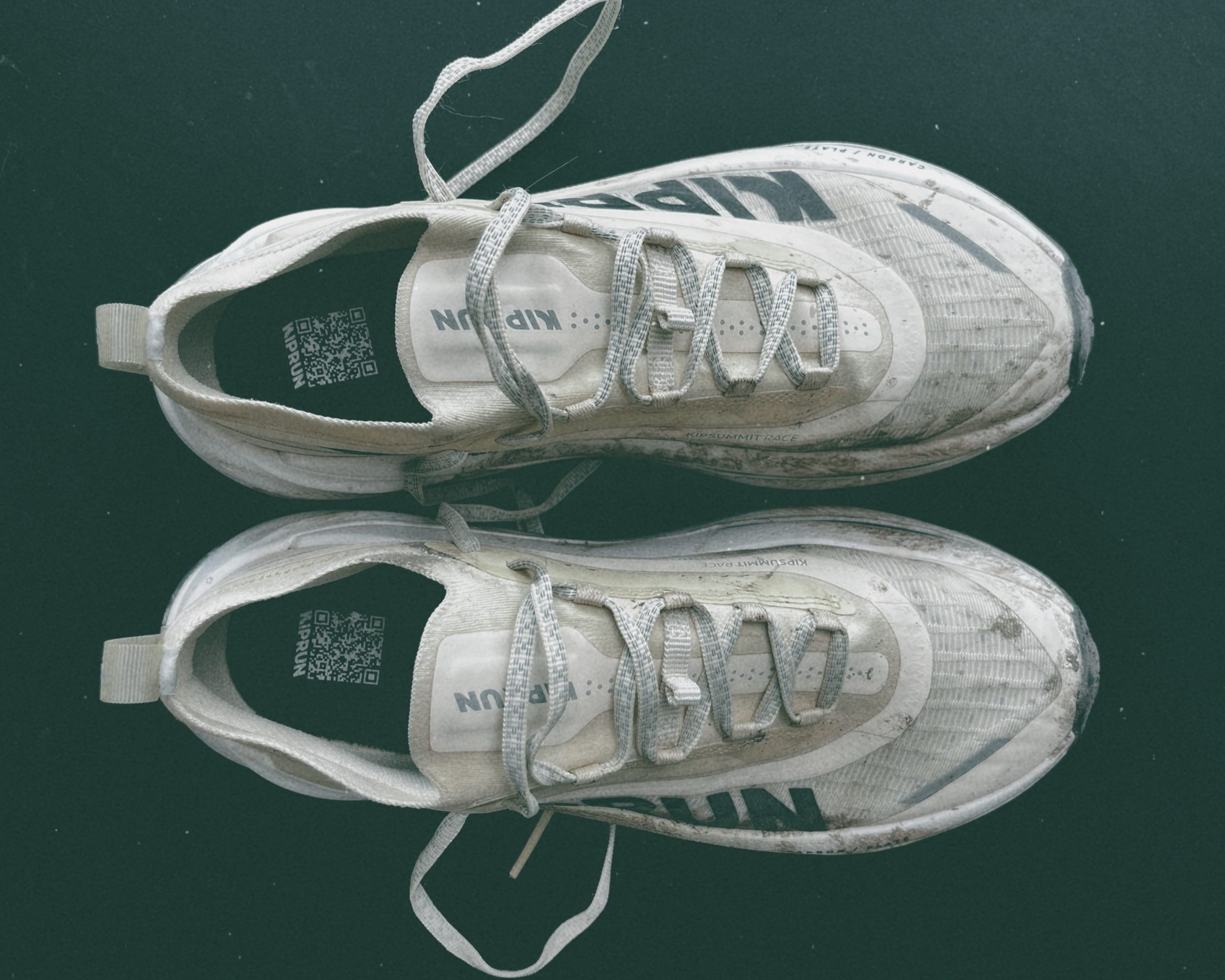 Worn-out white running shoes. Kiprun Kipsummit Race