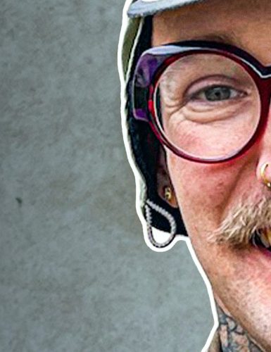 Smiling person with glasses and tattoos - Mike Kratzer