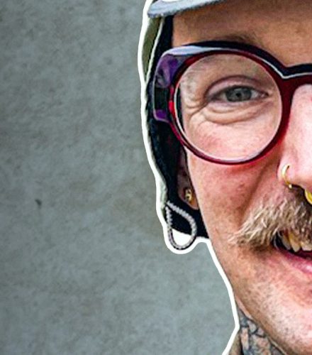 Smiling person with glasses and tattoos - Mike Kratzer