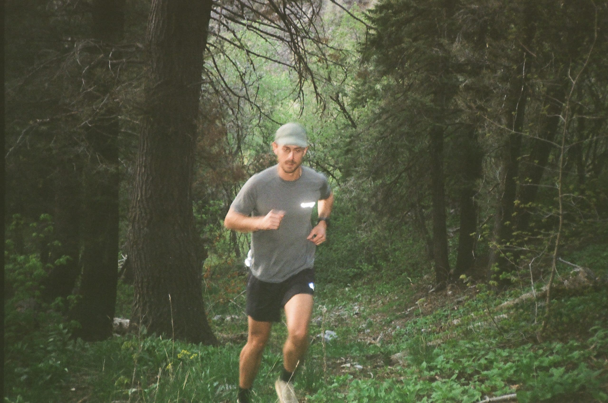 Klättermusen Man running through forest trail in Klättermusen