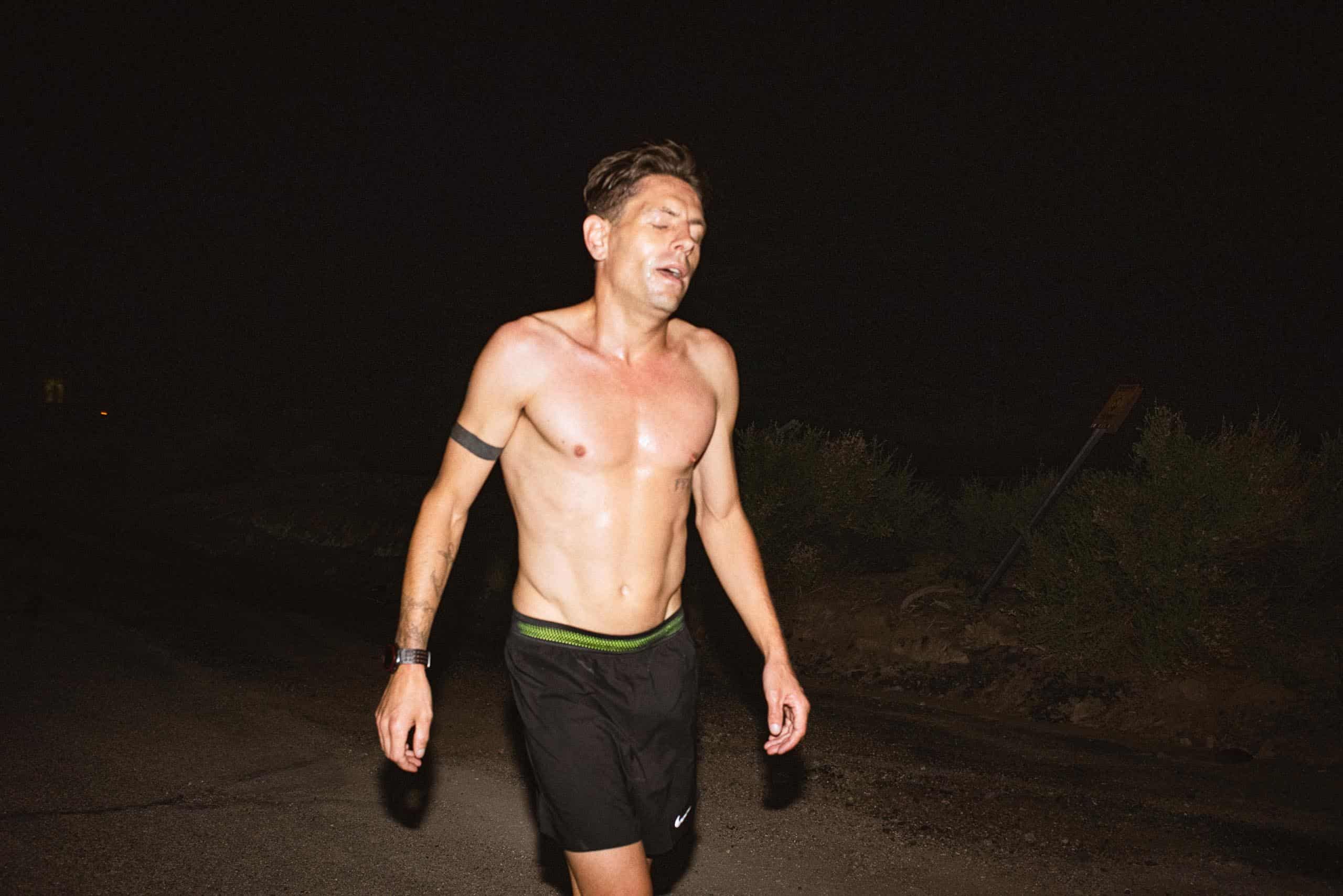 Nils Arend - Christian Brecheis for Borderlands Trail Running-9 Nils Arend, a tired runner without his shirt on in the dark