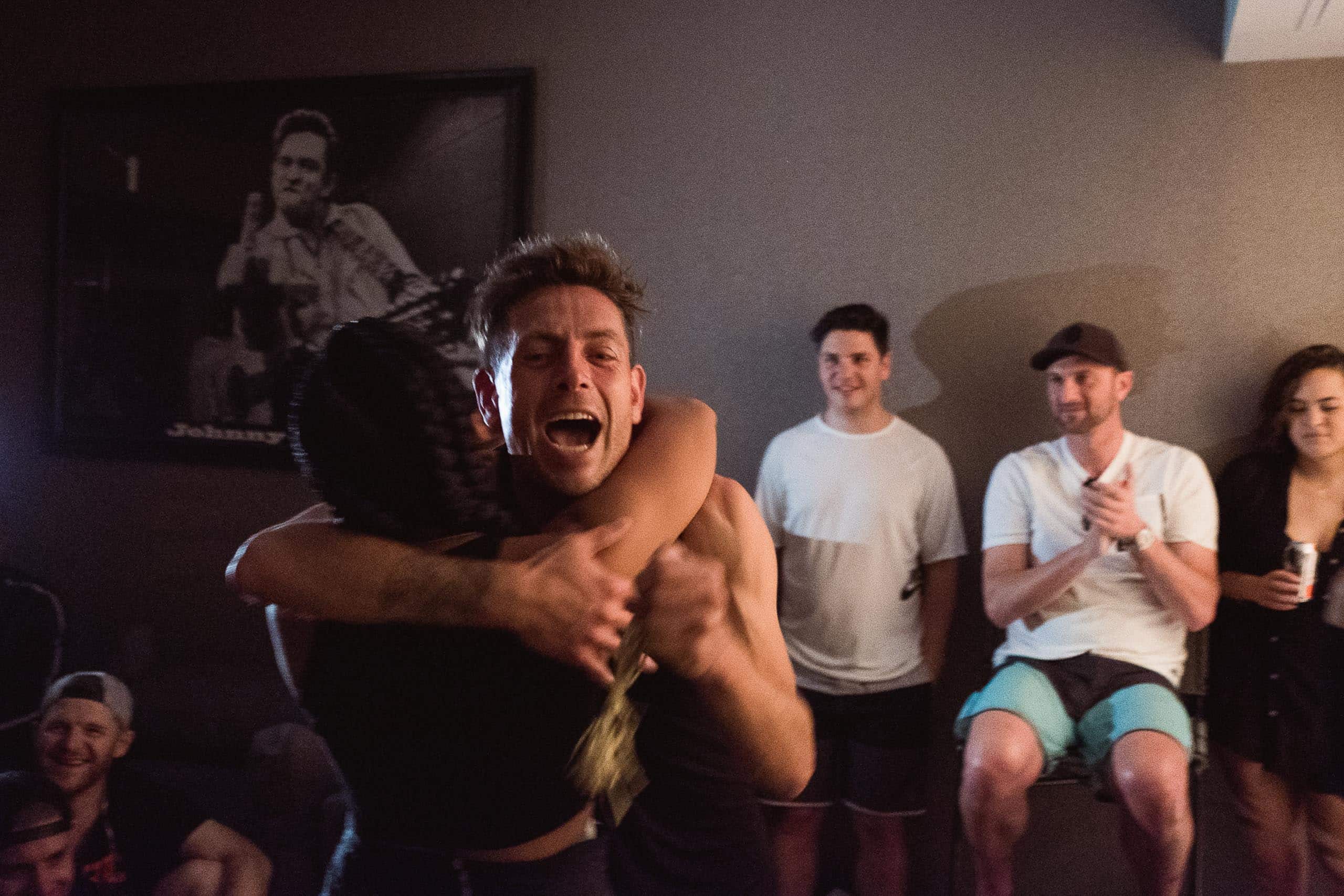Nils Arend - Christian Brecheis for Borderlands Trail Running Two people hugging and celebrating after the Speed Project