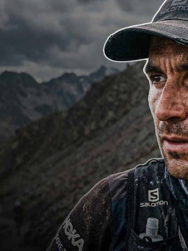 Determined athlete in rugged landscape.