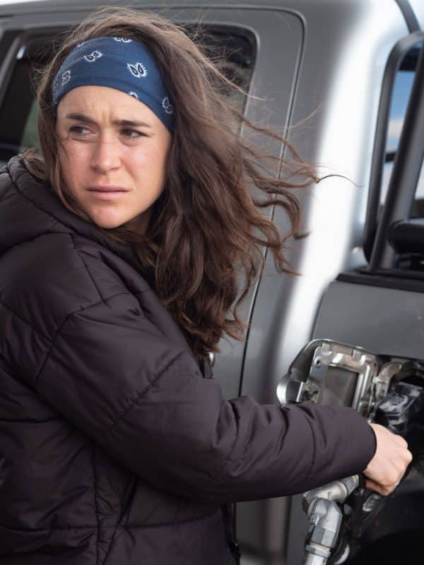Molly Seidel fueling vehicle at gas station.