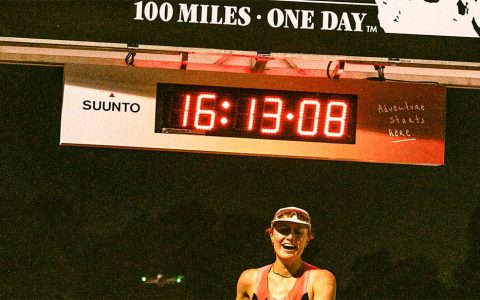 Runner Tara Dower celebrating at finish line